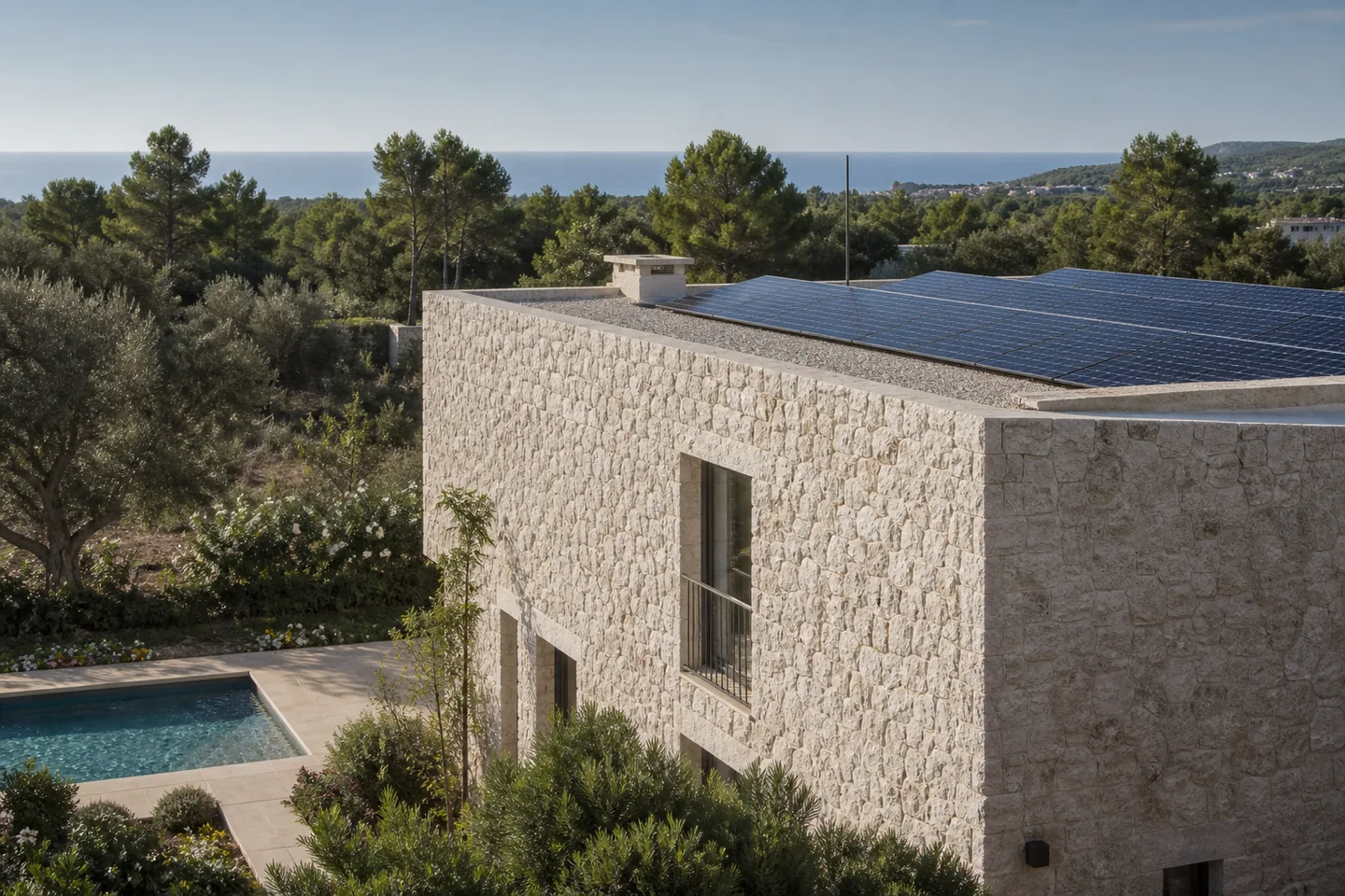 Mallorca limestone villa with flat-roof solar panels