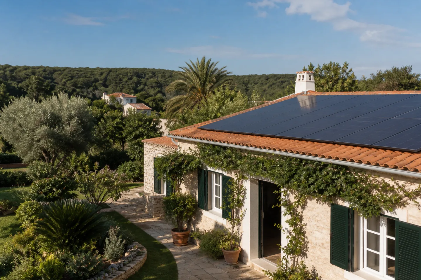 Menorca family home with solar panels on terracotta roof tiles